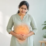 गैस और पेट फूलने की समस्या से परेशान महिला